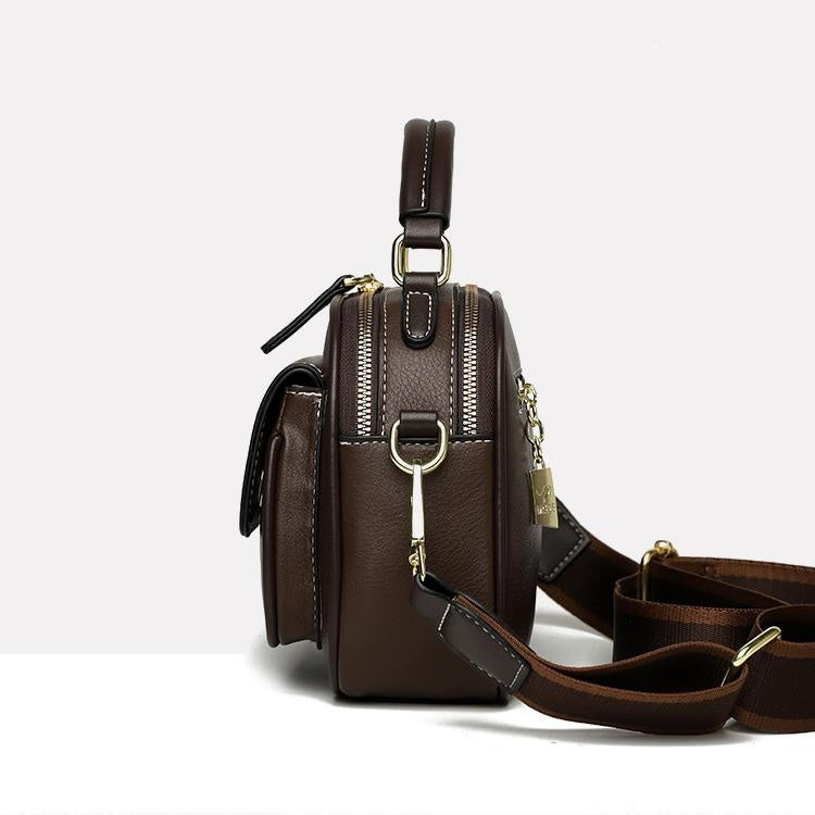 Tyylikäs olkalaukku, jossa on kaksoiskerros ja leveä hihna